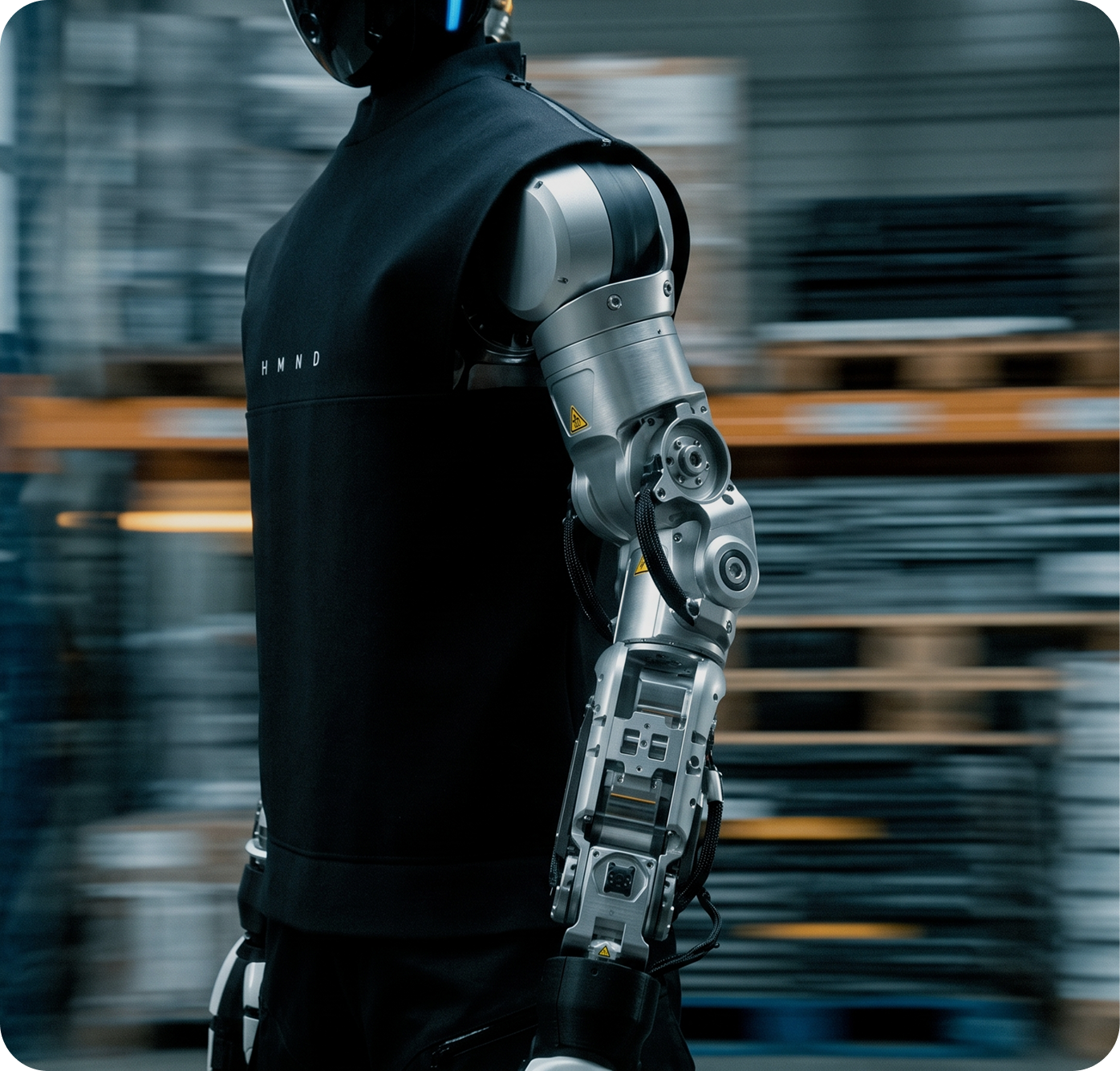 Humanoid robot moving through an industrial workspace