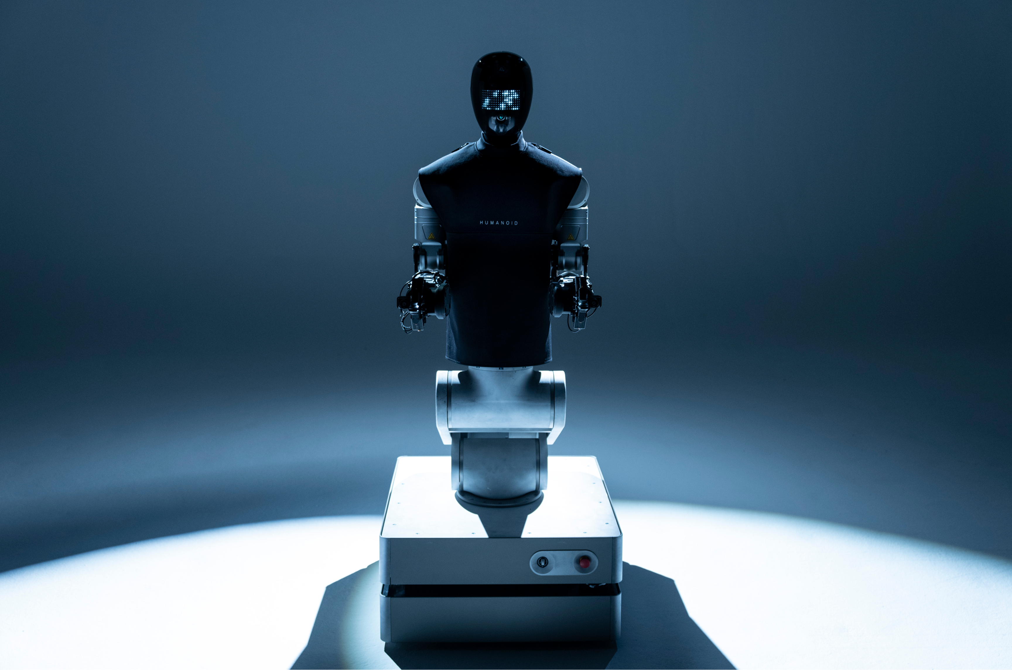 Alpha Wheeled humanoid robot in a dark blue studio