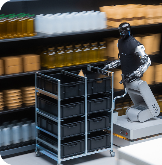 Humanoid robot moving warehouse totes along shelving